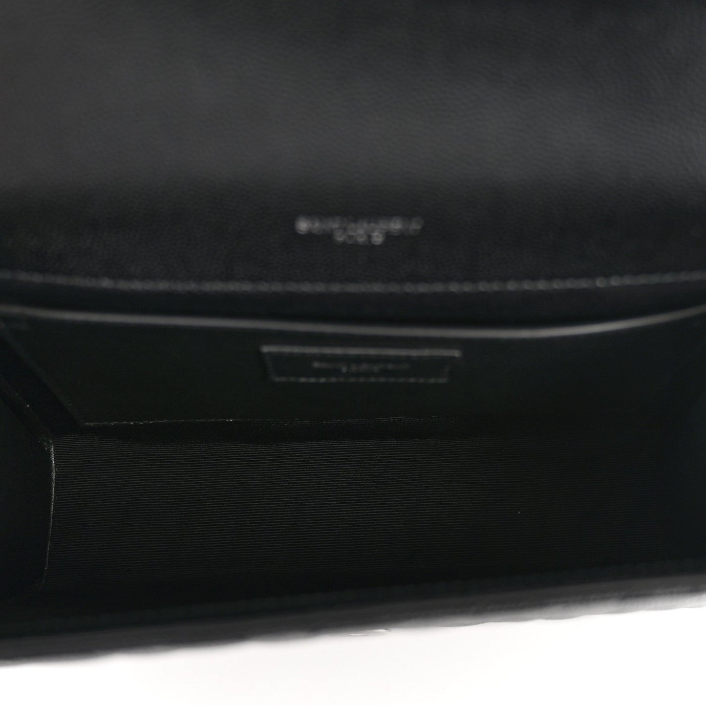 Black interior lining with stamped brand mark and pocket label