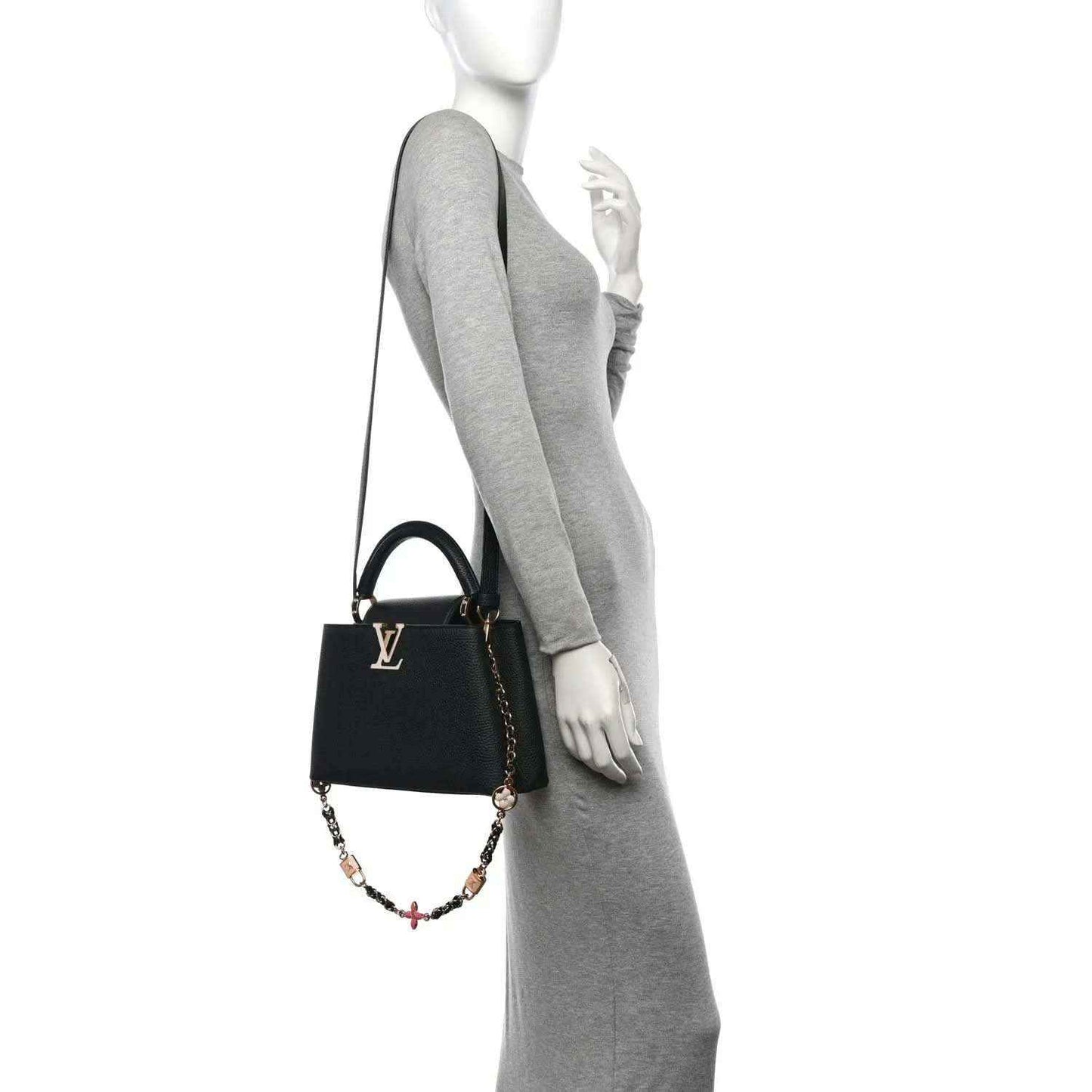 Black leather mini handbag with chain crossbody strap on model