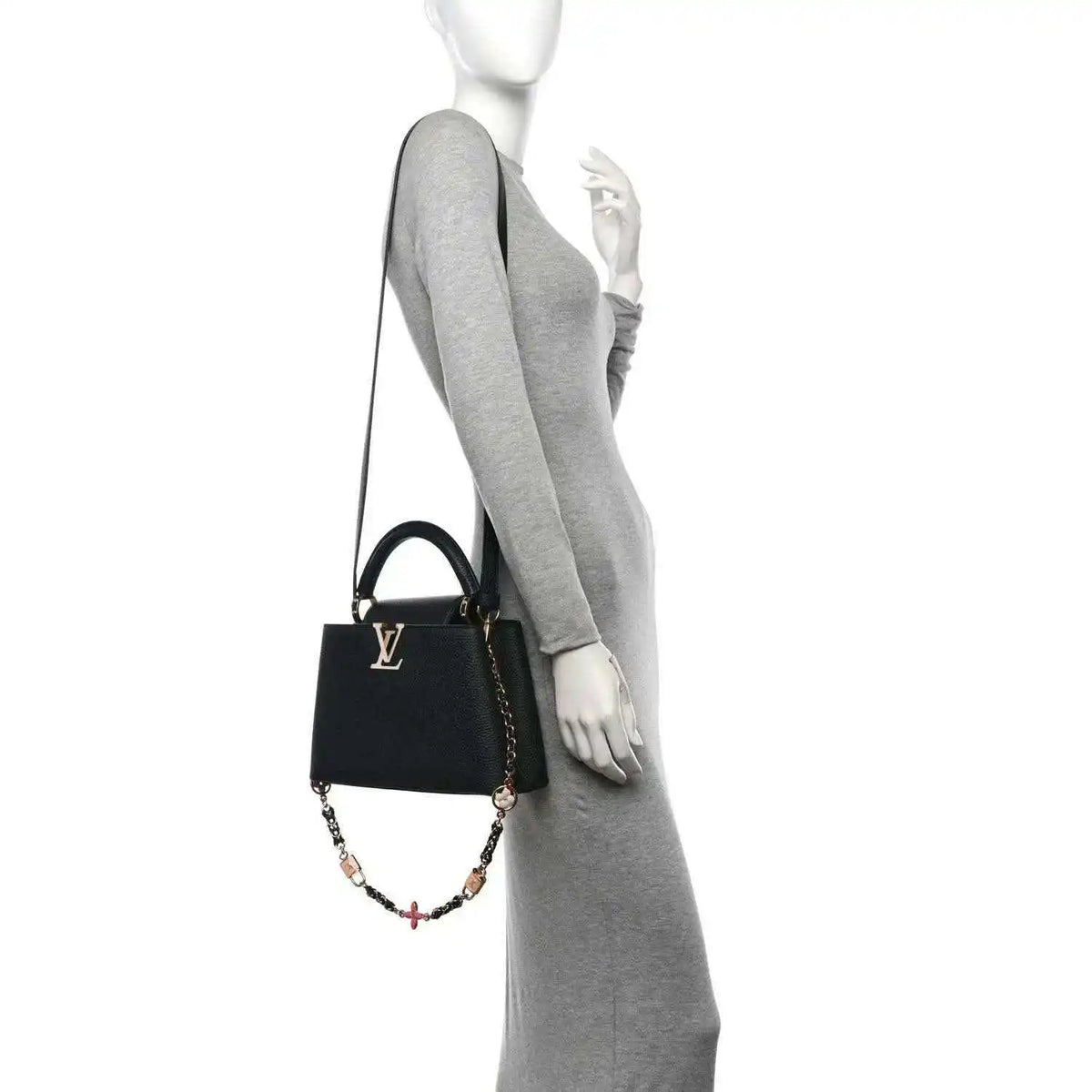 Black leather mini handbag with chain crossbody strap on model