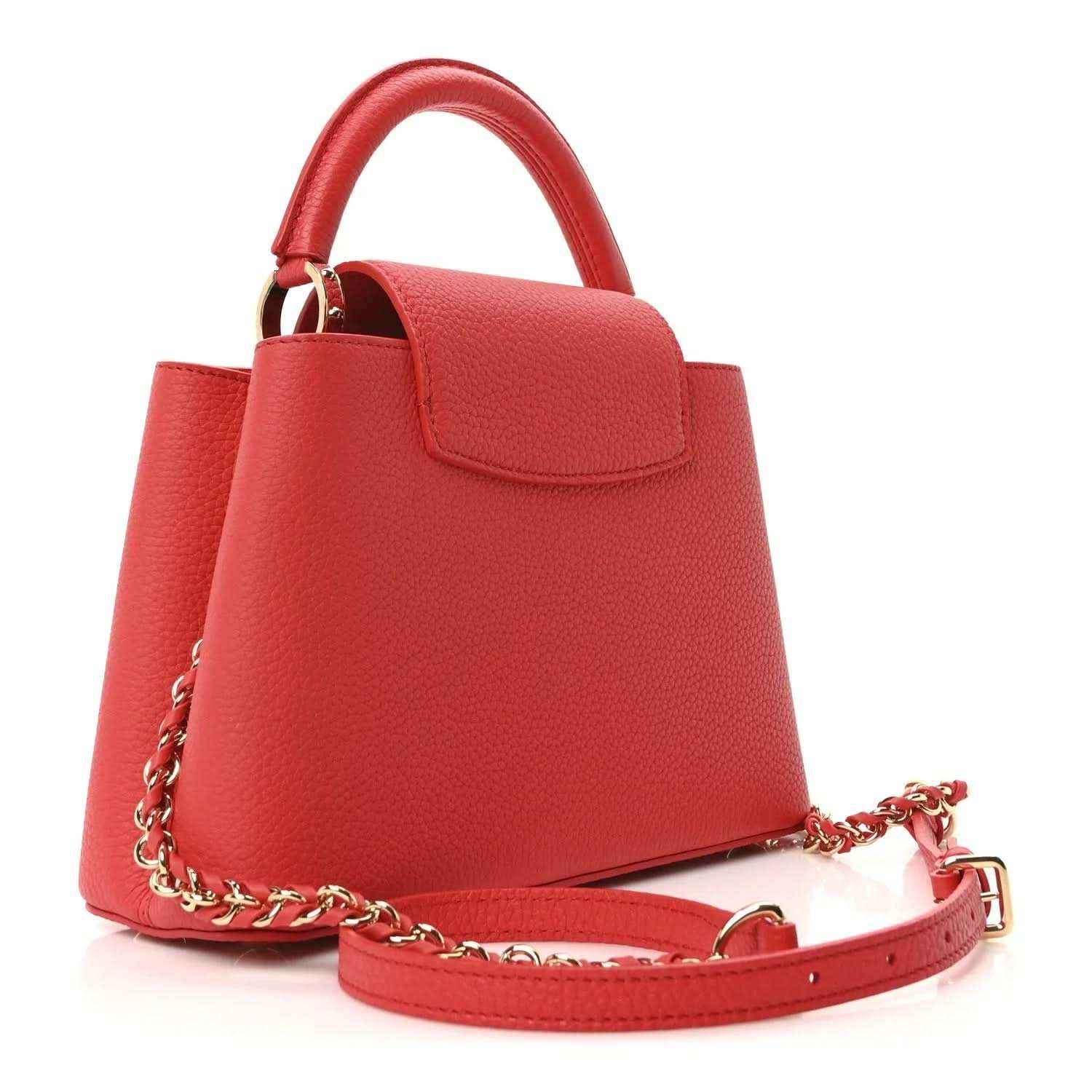 Red leather mini handbag with structured shape, gold hardware, and chain shoulder strap.