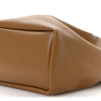 Loewe nappa small squeeze bag in oak-brown leather, close-up of folded side