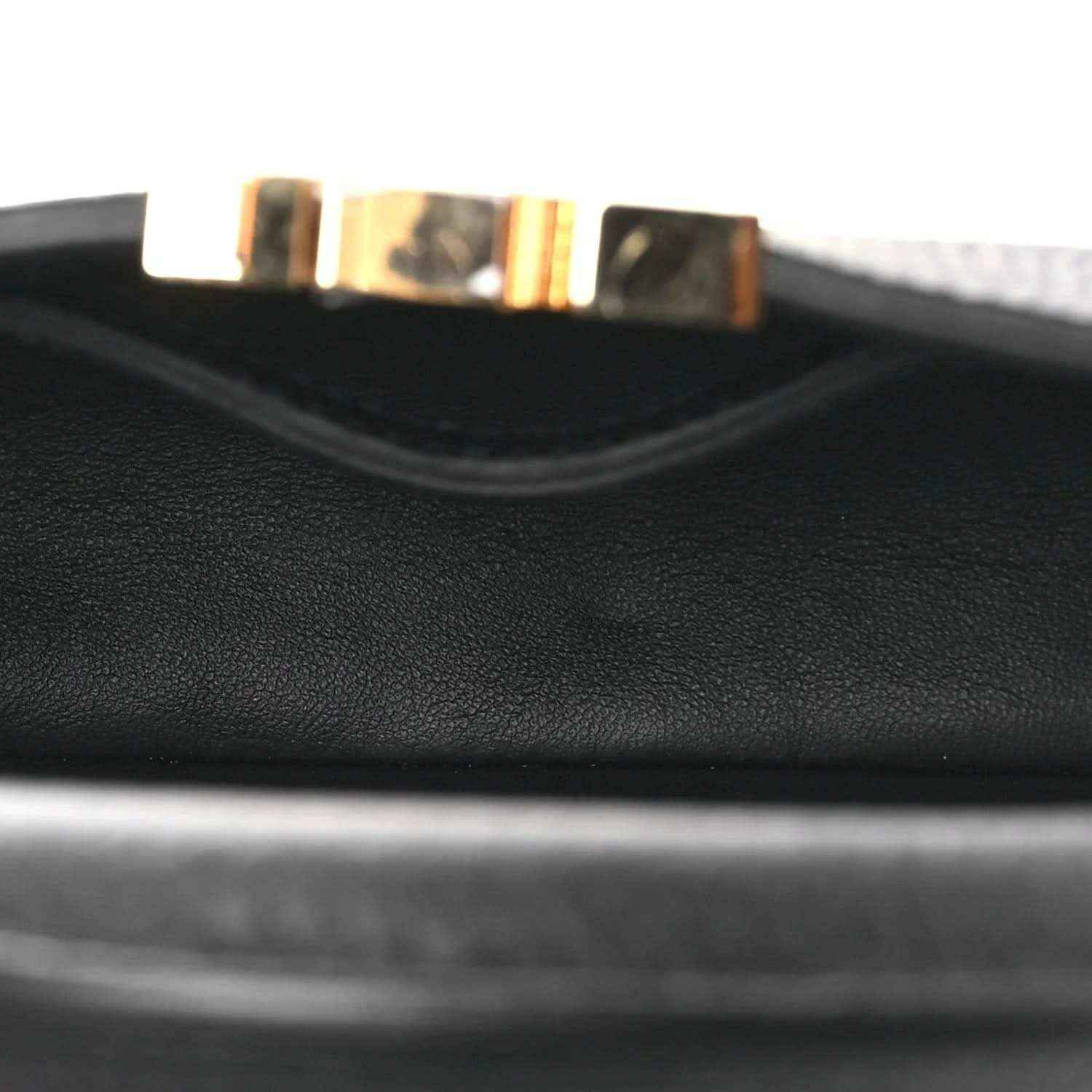 Black leather handbag interior lining edge with stitched trim