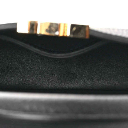 Black leather handbag interior lining edge with stitched trim