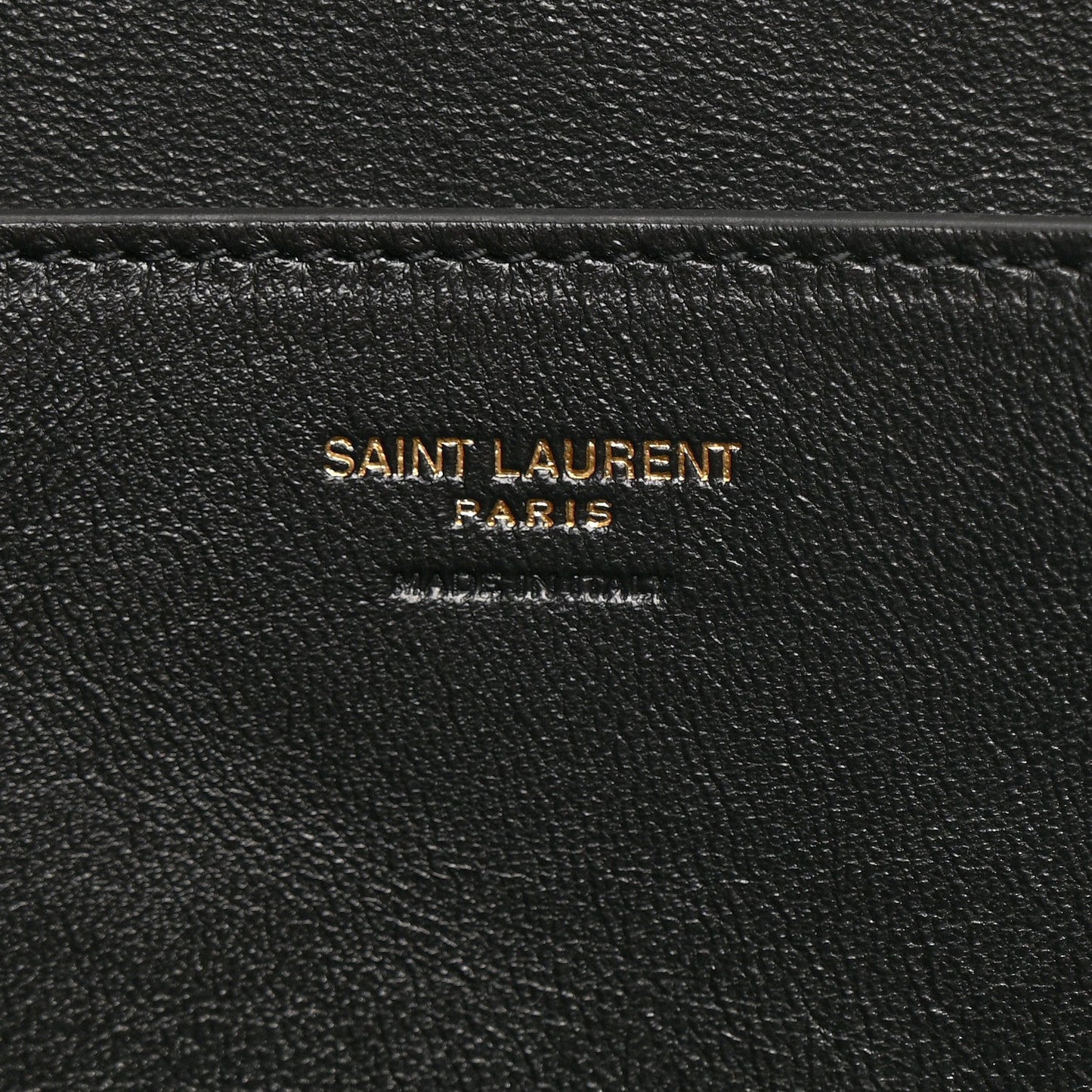 Black leather interior label reading SAINT LAURENT PARIS