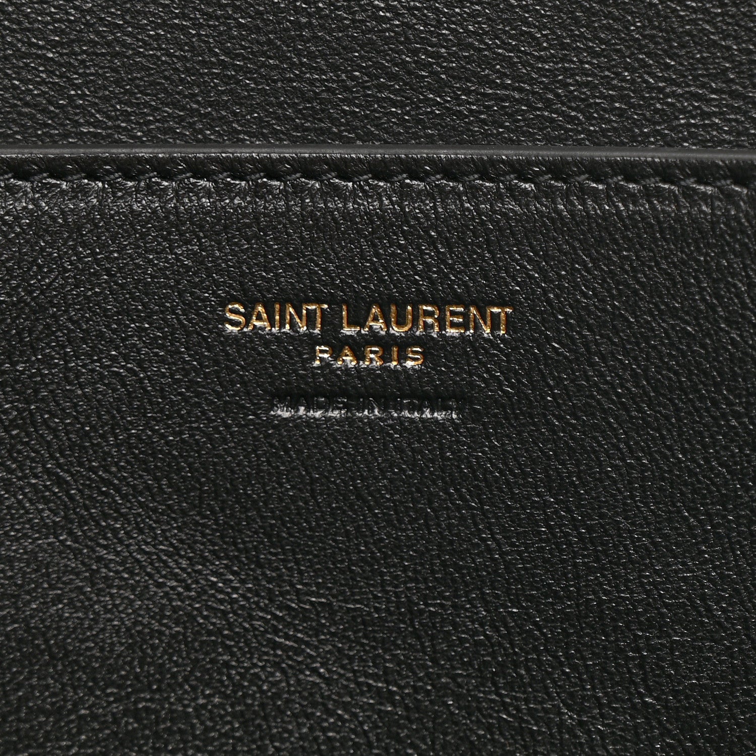 Black leather interior label reading SAINT LAURENT PARIS