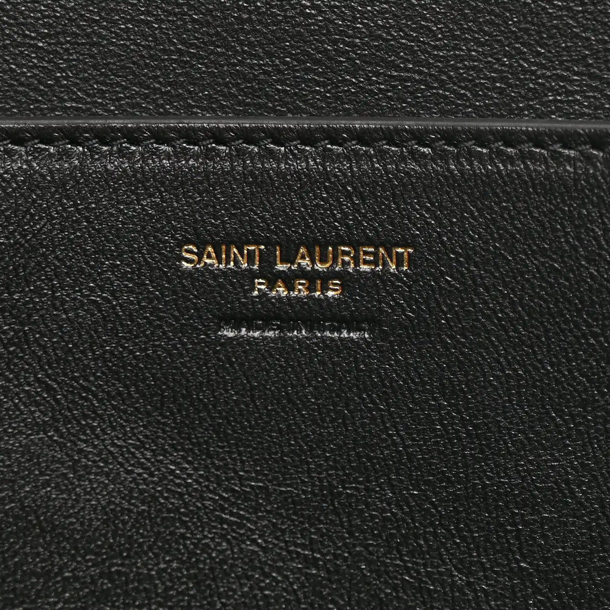 Black leather interior label reading SAINT LAURENT PARIS