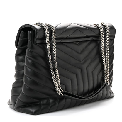 Black quilted leather flap satchel with silver chain and YSL logo