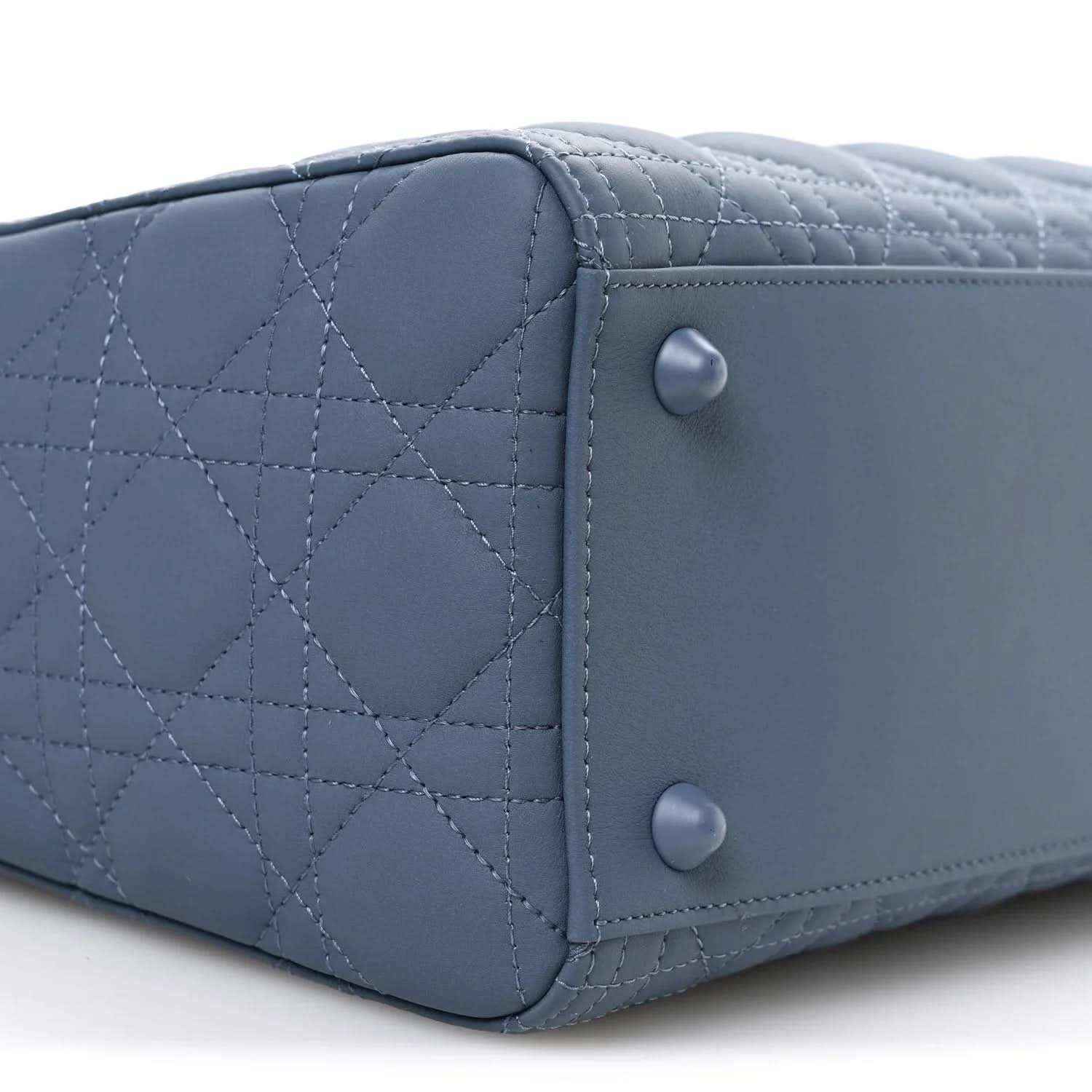 Denim blue quilted Lady Dior bag side panel with snap button