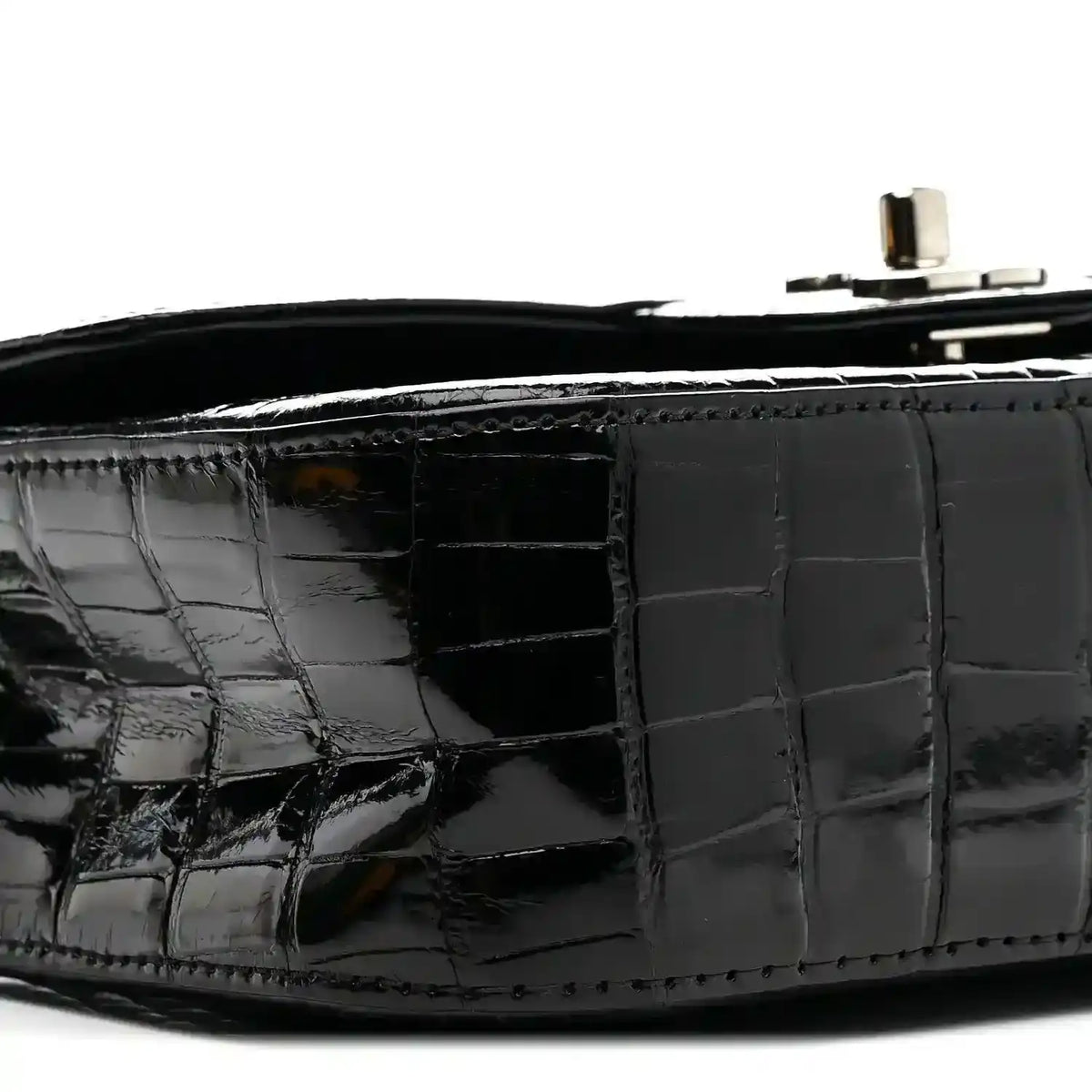 Black glossy alligator side panel with flap seam and interior opening.