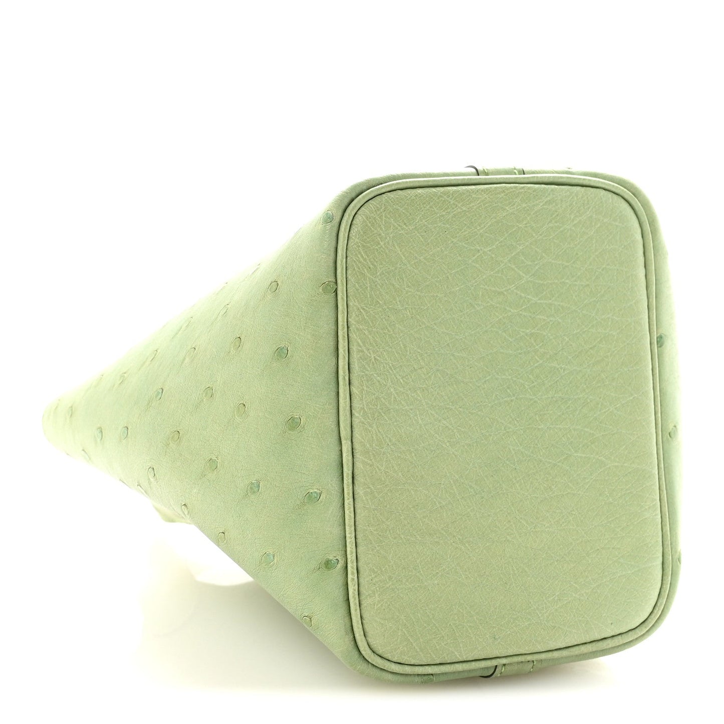 Green mini handbag end panel with rounded-rectangle trim and subtle grain texture
