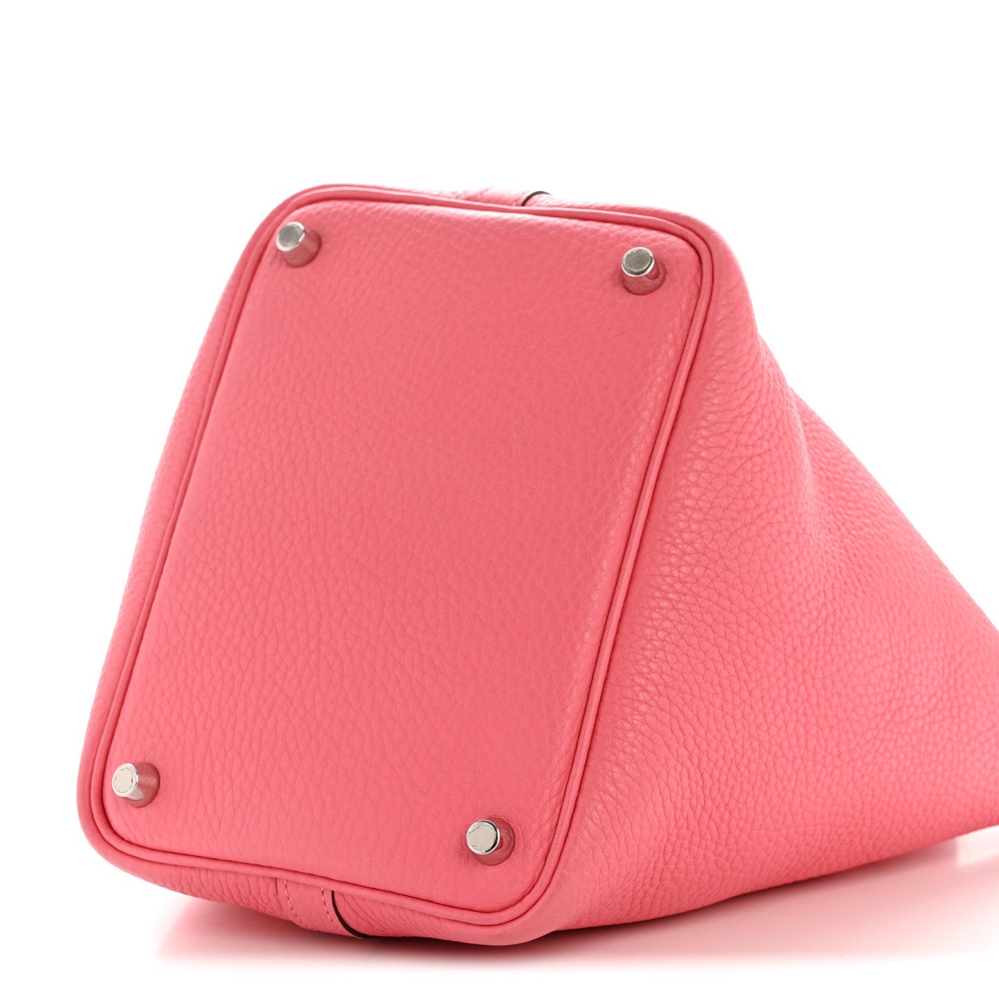 Pink leather tote with metal corner studs and top handle strap