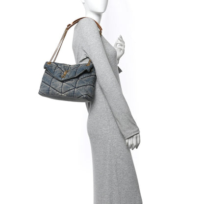 Denim quilted puffer satchel with chain shoulder strap and tan leather trim