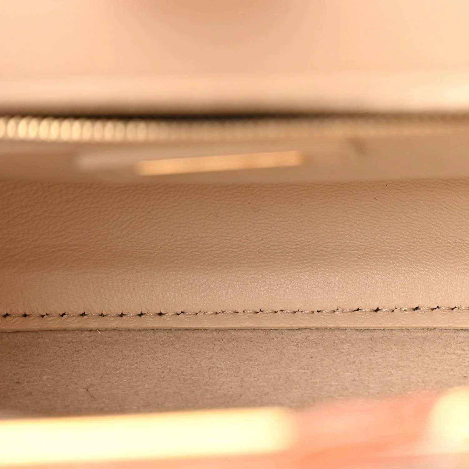 Mini Peekaboo satchel interior close-up with stitched detailing along edge