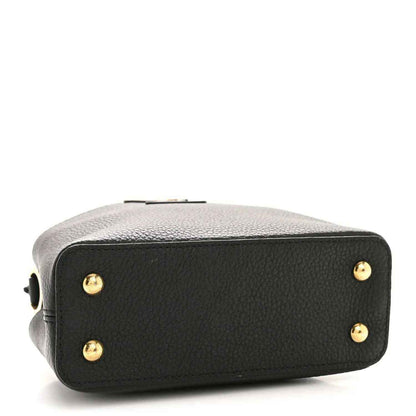 Black pebbled leather mini handbag back with gold snap studs