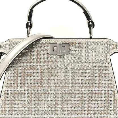 Small crystal satchel front close-up with top handle and FF pattern panel