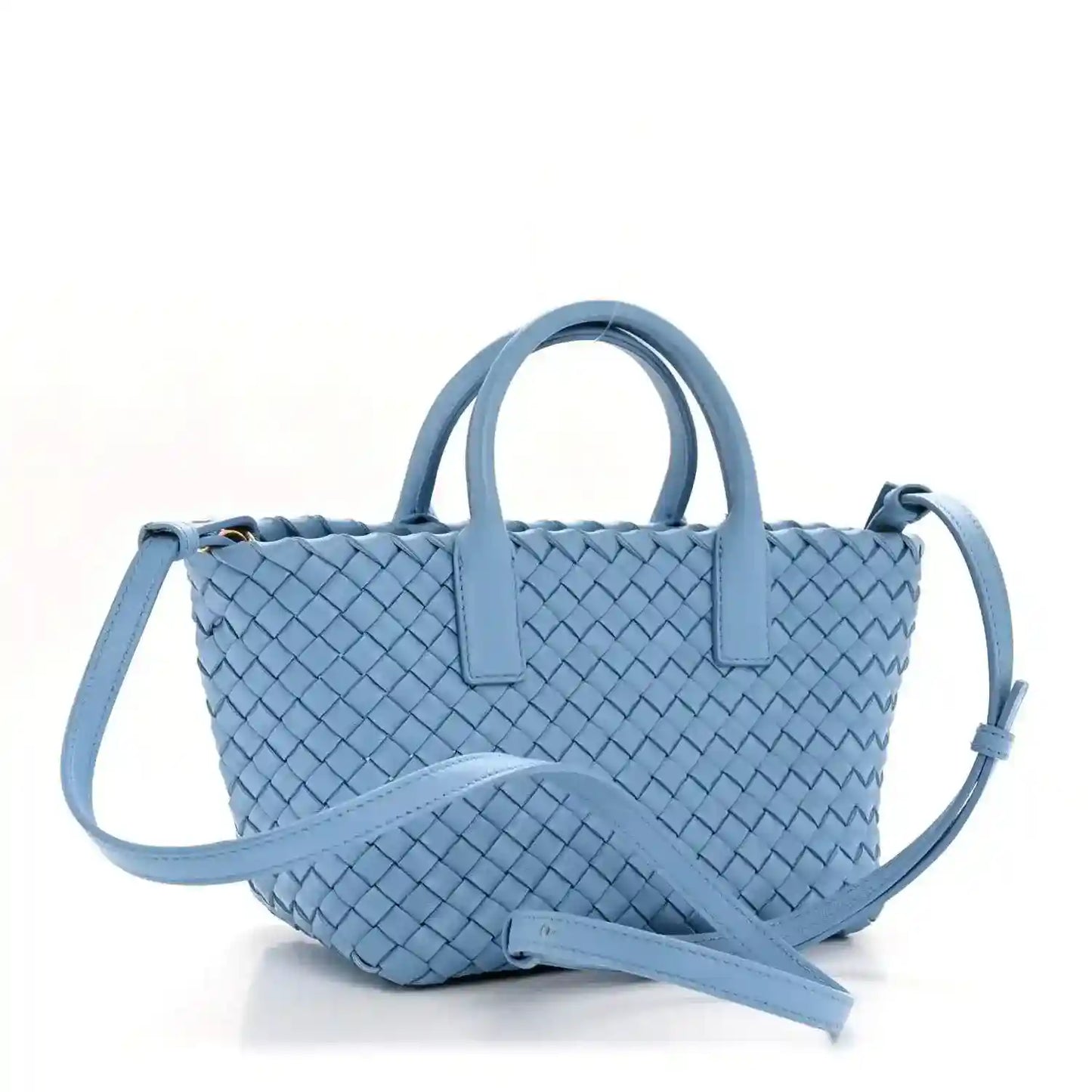 Blue woven mini cabat tote with two top handles and crossbody strap, angled view