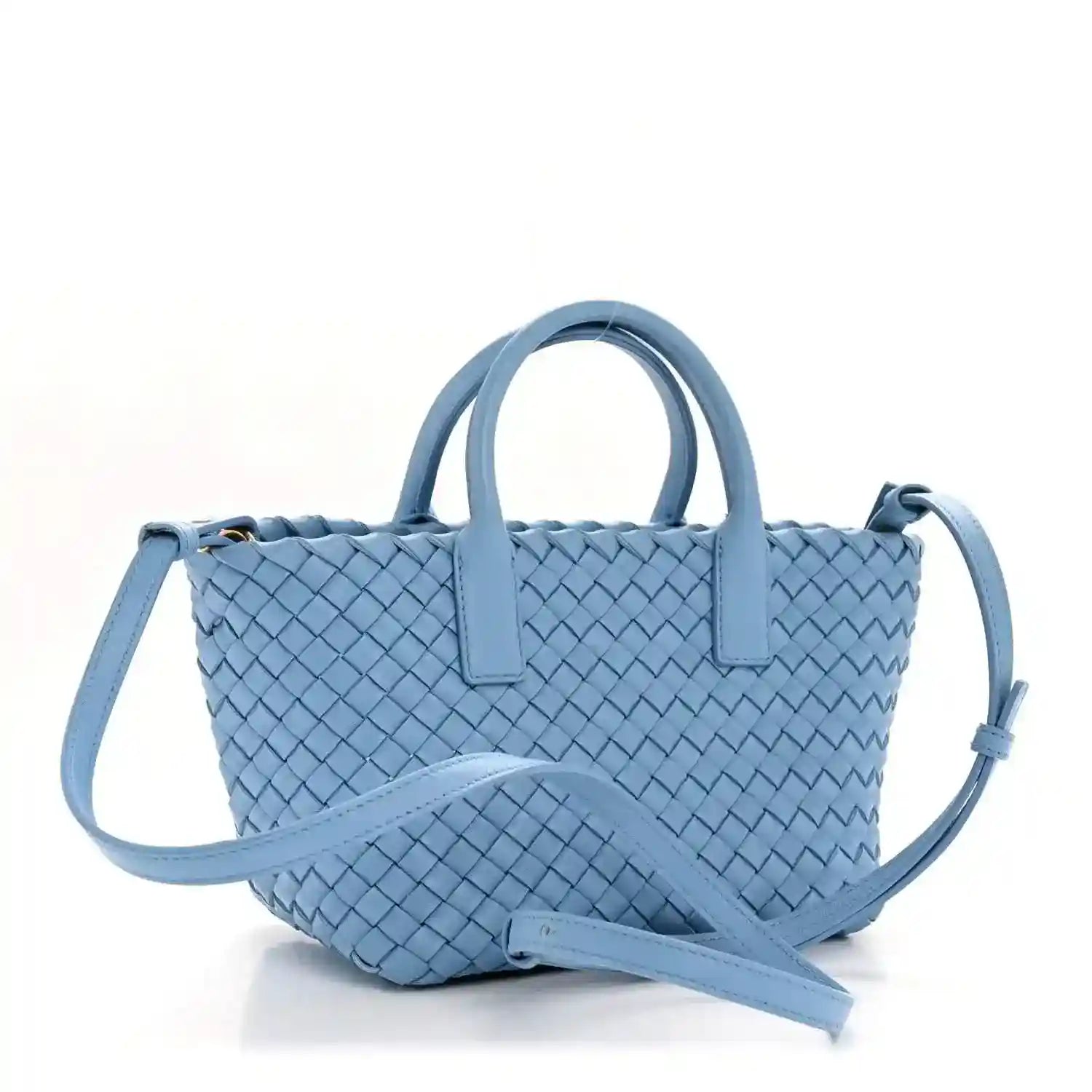 Blue woven mini cabat tote with two top handles and crossbody strap, angled view