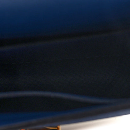 Blue leather wallet close-up of cover edge and smooth surface