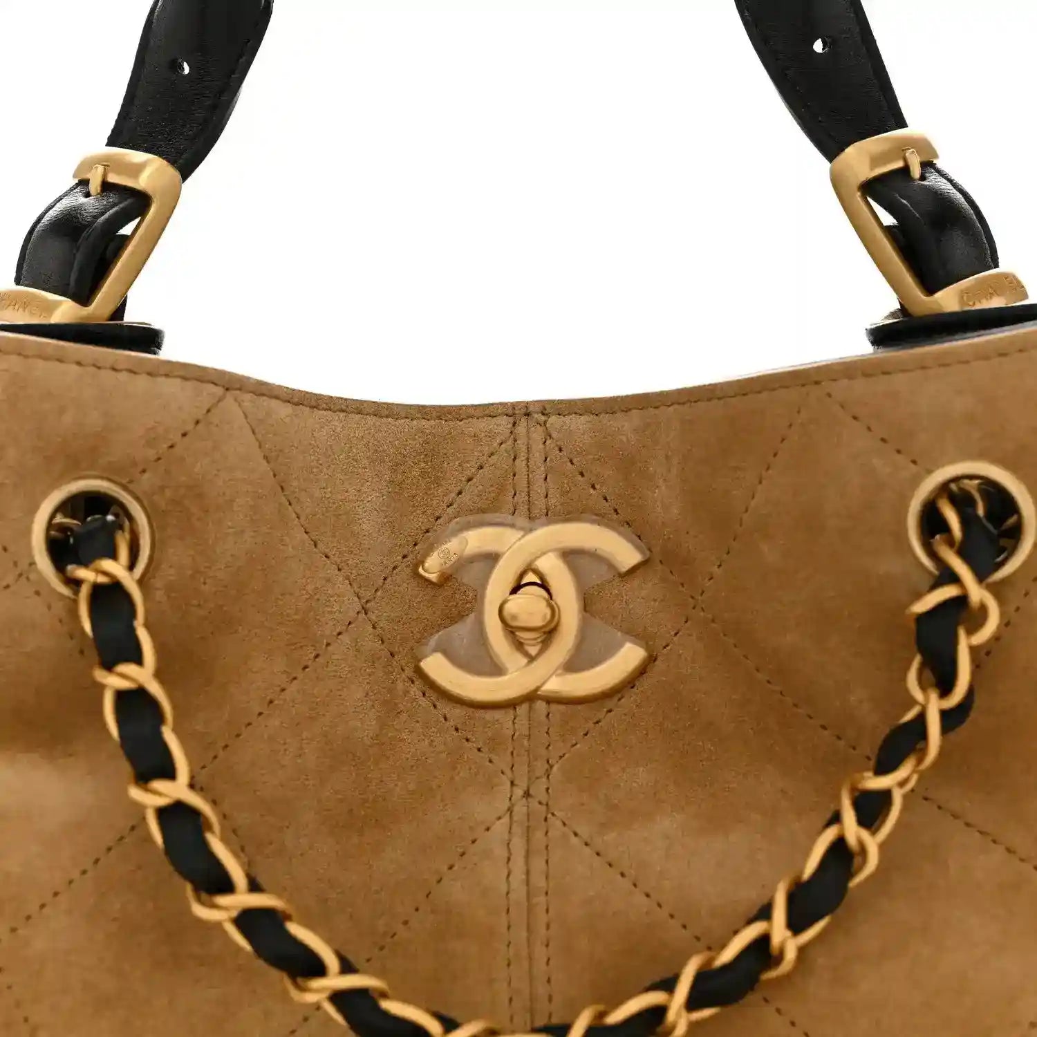 Chanel shopping bag front with CC logo, beige quilted panels, black leather chain handles