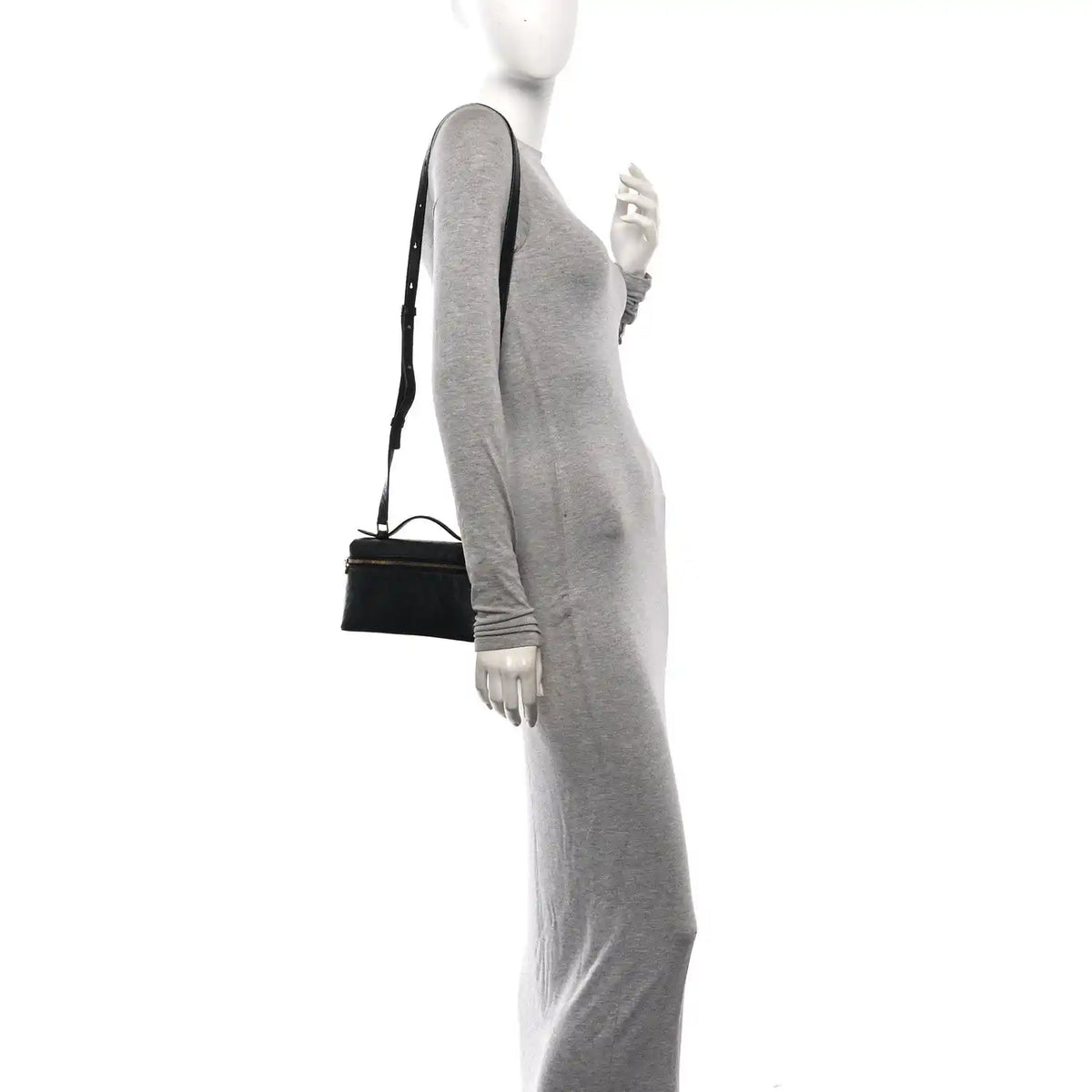 Black ostrich pocket pouch with shoulder strap worn at side on model