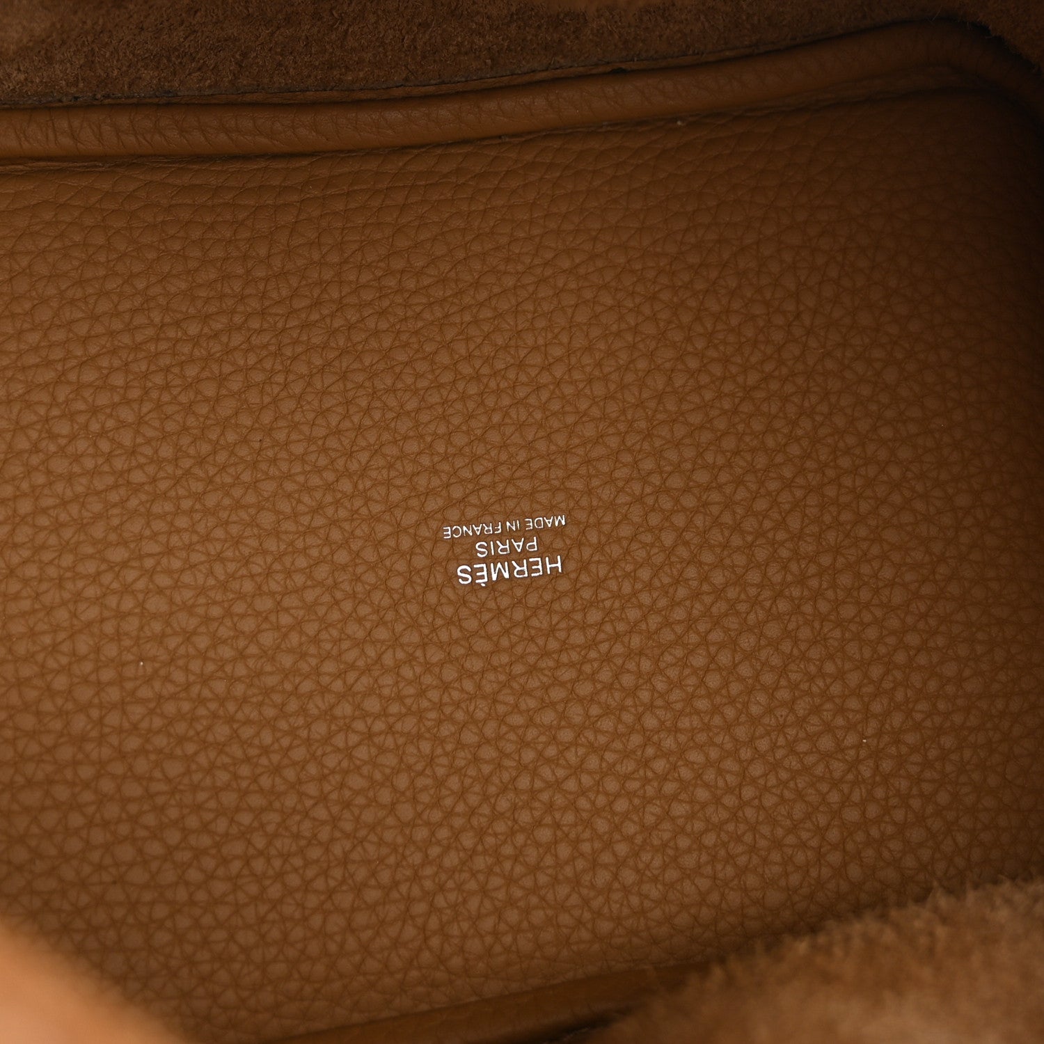 Tan leather interior with embossed logo stamp