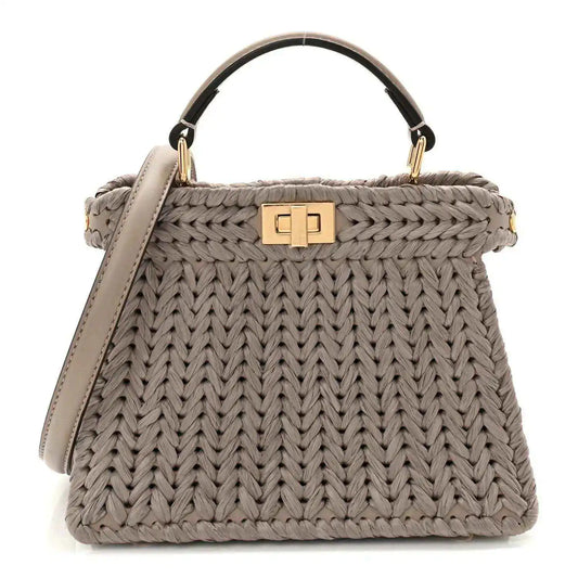 Gray woven raffia and leather satchel with top handle and gold clasp