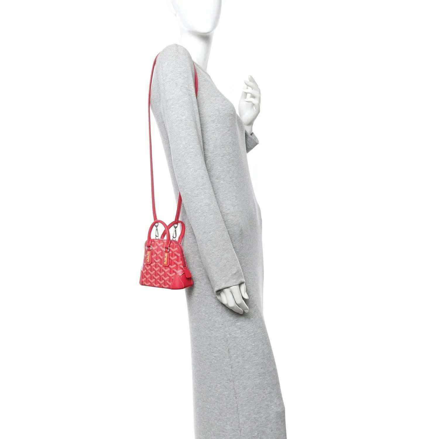 Mini handbag hanging on a mannequin, red leather and patterned body with short strap