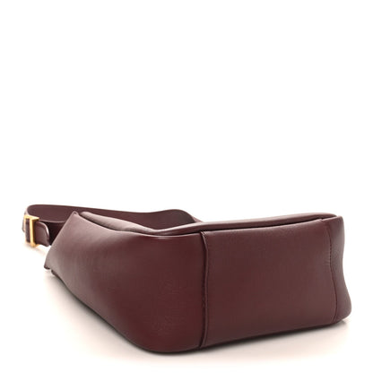 Burgundy smooth calfskin small hobo bag with gold-tone buckle strap