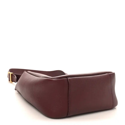 Burgundy smooth calfskin small hobo bag with gold-tone buckle strap