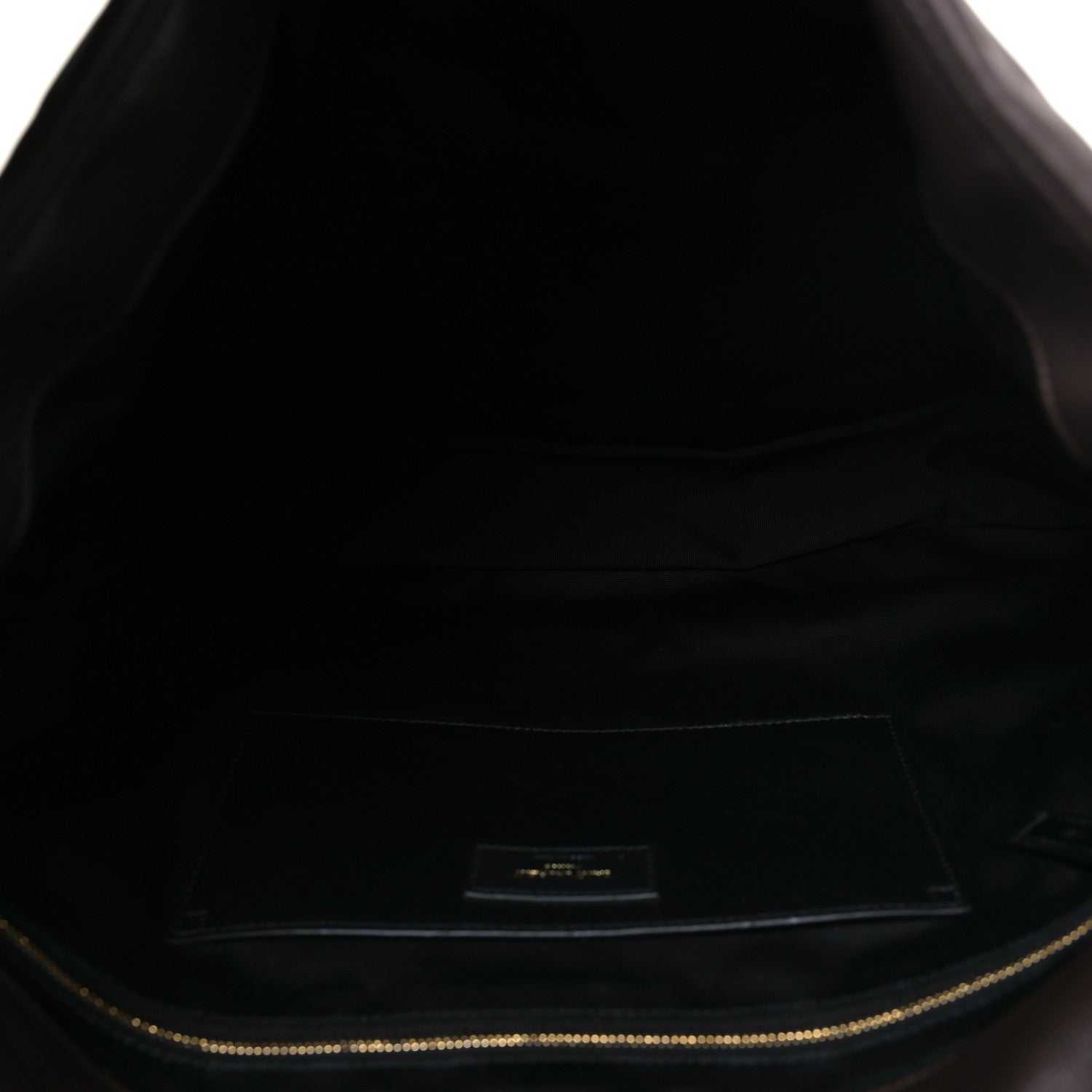 Dark-brown leather shoulder bag interior lining with gold-tone zipper trim and label