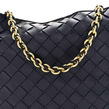 Black woven leather hobo bag with gold chain strap and front braided texture