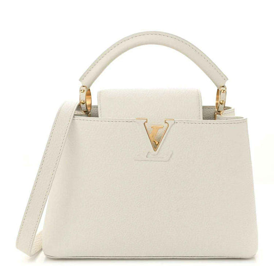 White top-handle bag with gold V logo and structured front flap