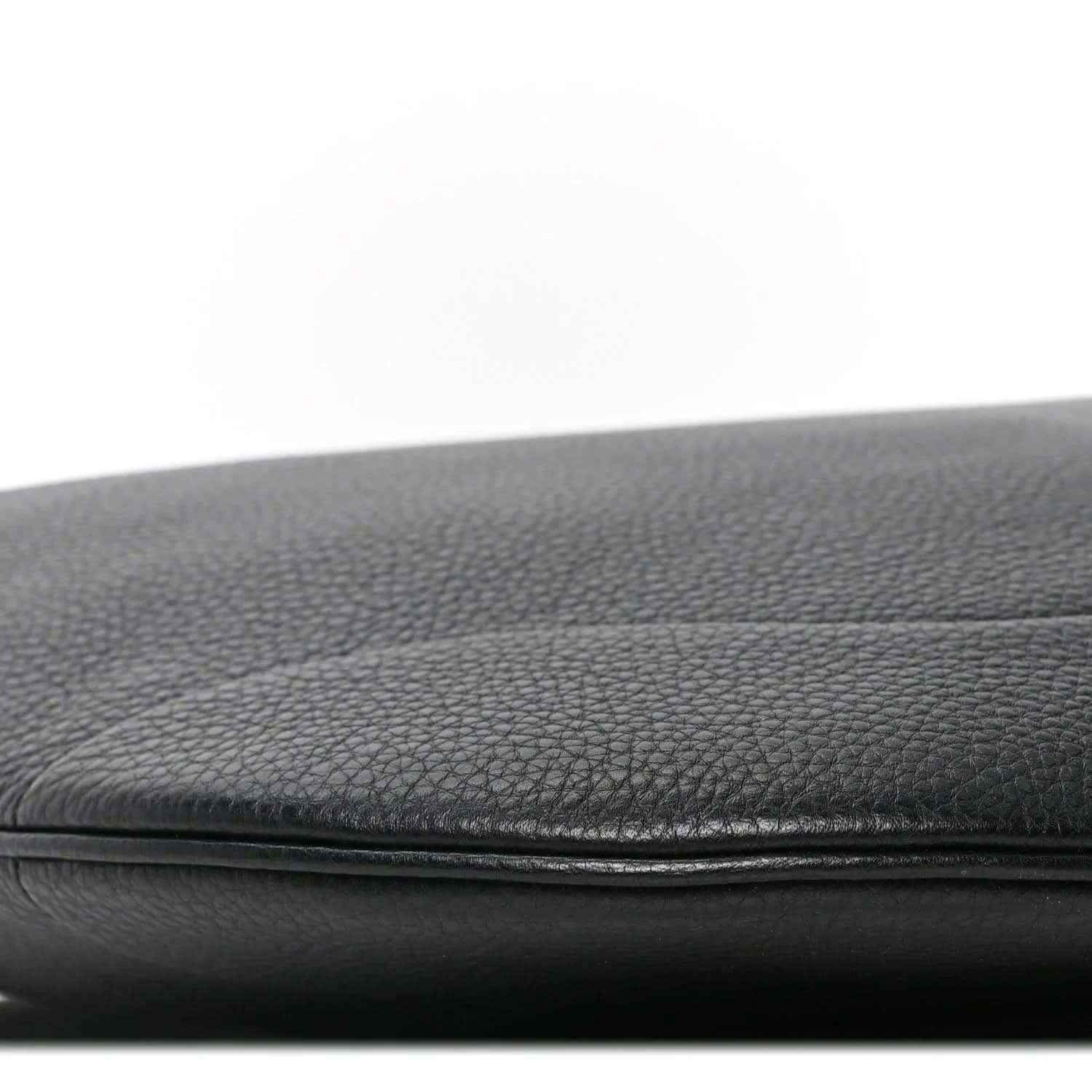 Black grained leather bag edge with stitched seam