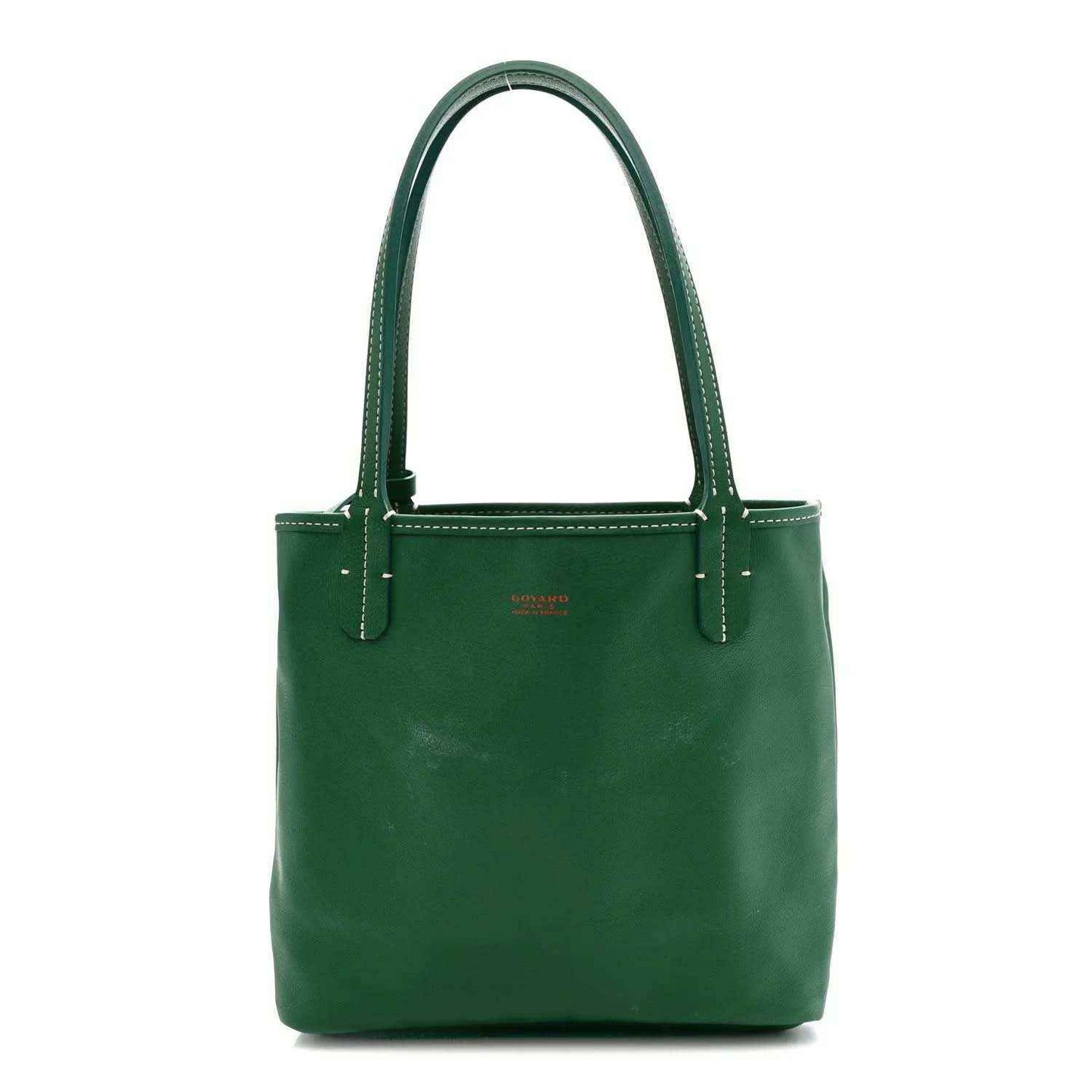 Green mini tote bag with solid body and top handles, no exterior pattern visible