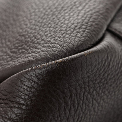 Grained deerskin tote leather detail with neat seam and brushed hardware