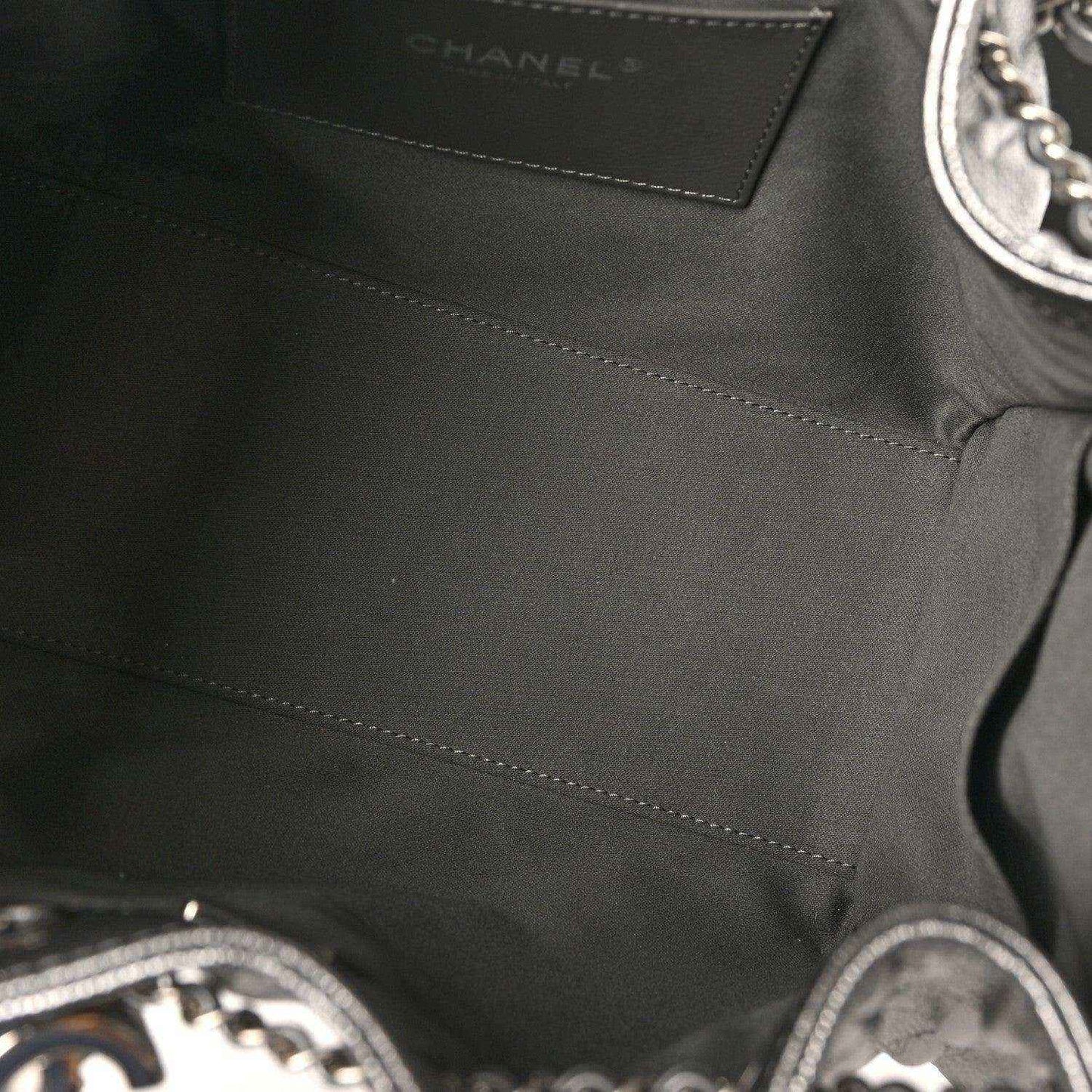 Chanel handbag interior close-up with stitched lining and brand label