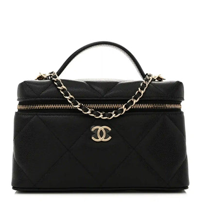 Black quilted leather slim vanity bag with gold chain, zipper top, and CC logo charm