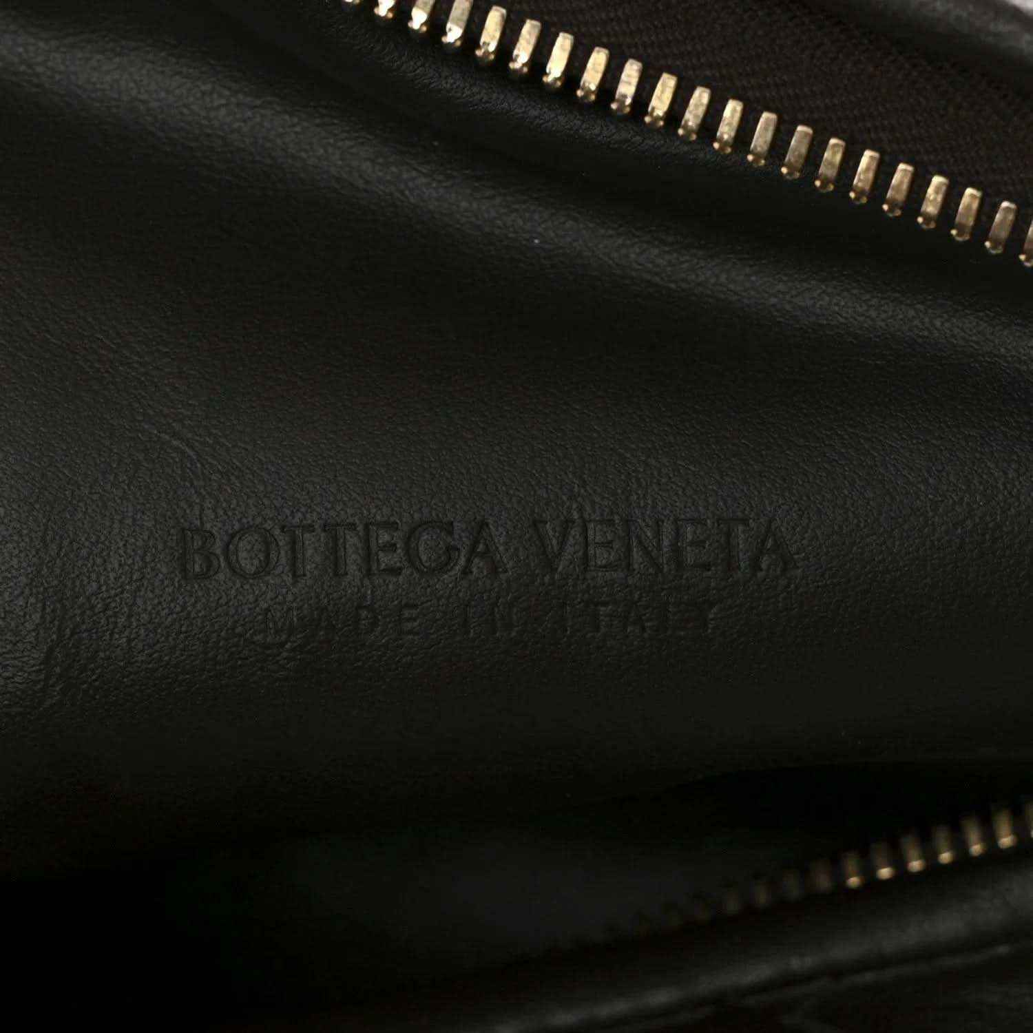 Bottega Veneta logo on dark leather lining with gold-tone zipper trim