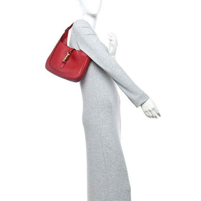 Red leather hobo bag with short shoulder strap and gold hardware clasp