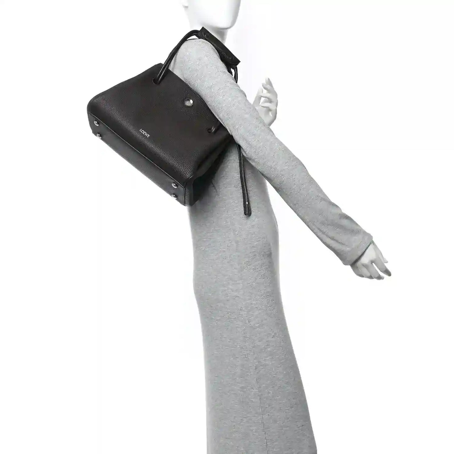 Loewe Madrid medium bag in dark leather with wrist strap and top handle loop