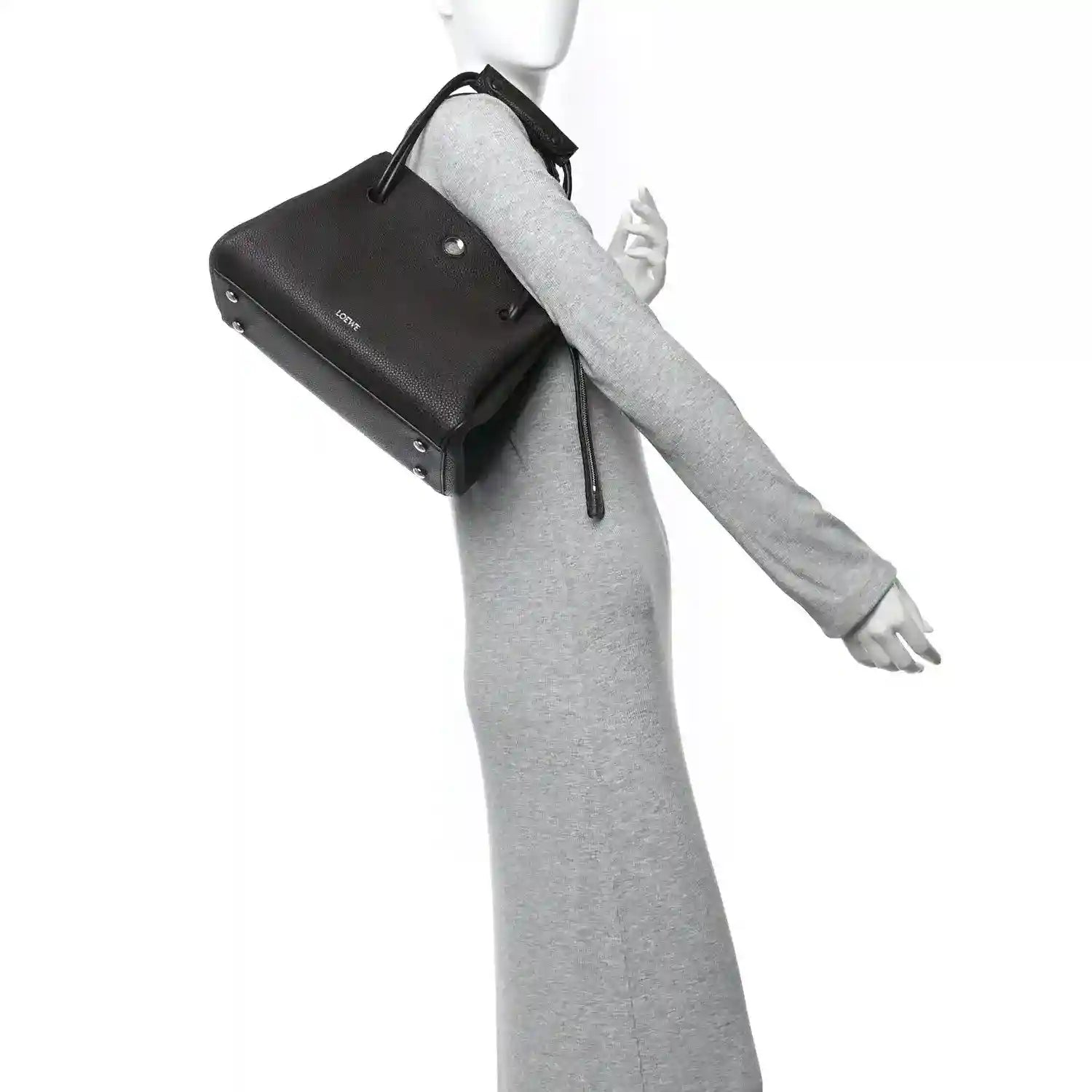Loewe Madrid medium bag in dark leather with wrist strap and top handle loop