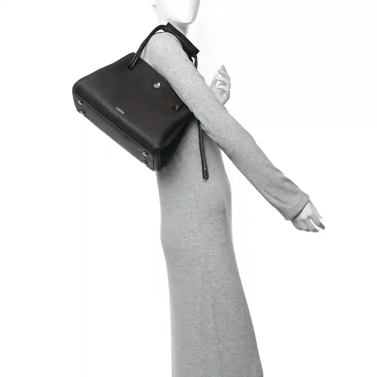 Loewe Madrid medium bag in dark leather with wrist strap and top handle loop