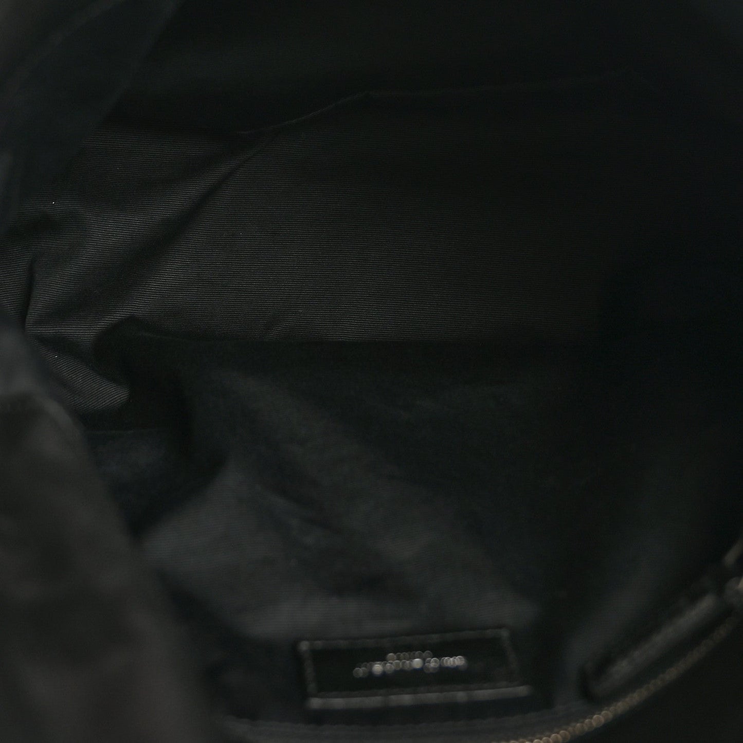 Black quilted leather satchel interior lining with small label patch