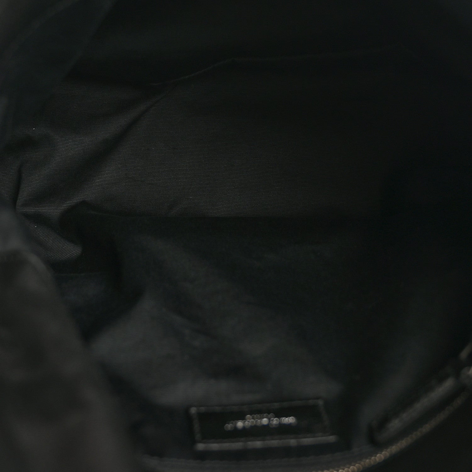 Black quilted leather satchel interior lining with small label patch