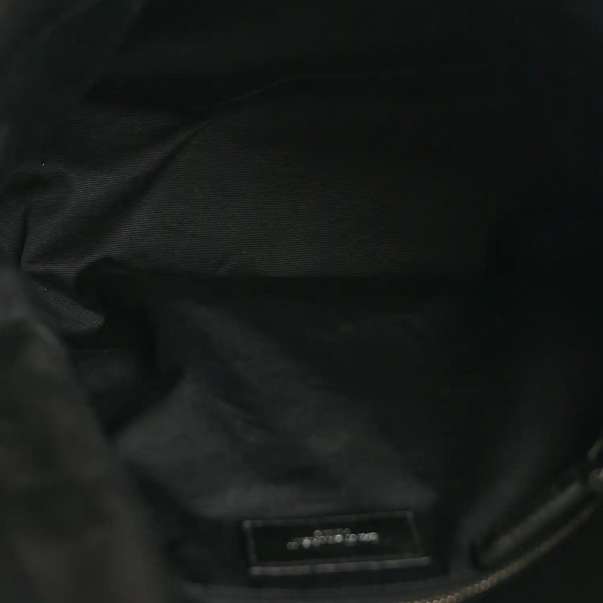 Black quilted leather satchel interior lining with small label patch