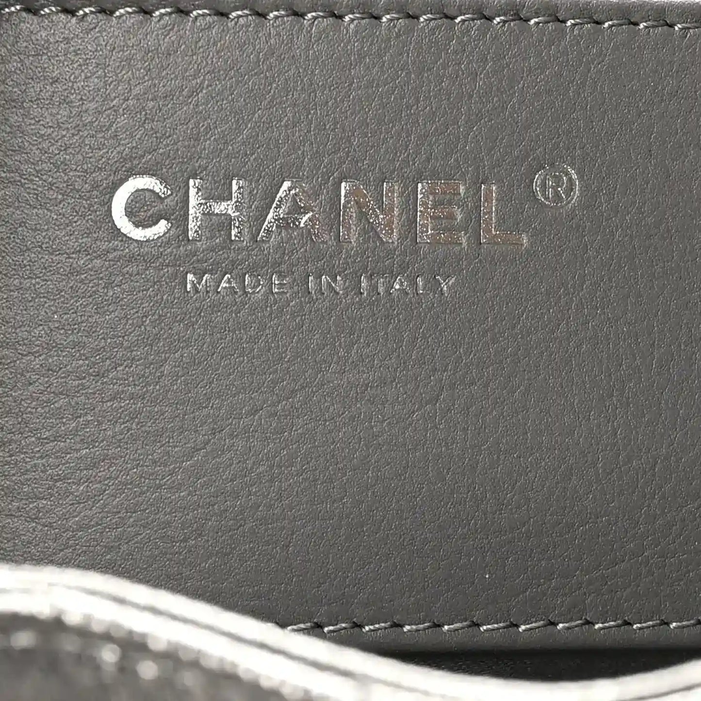 Chanel leather handbag label reading CHANEL and MADE IN ITALY