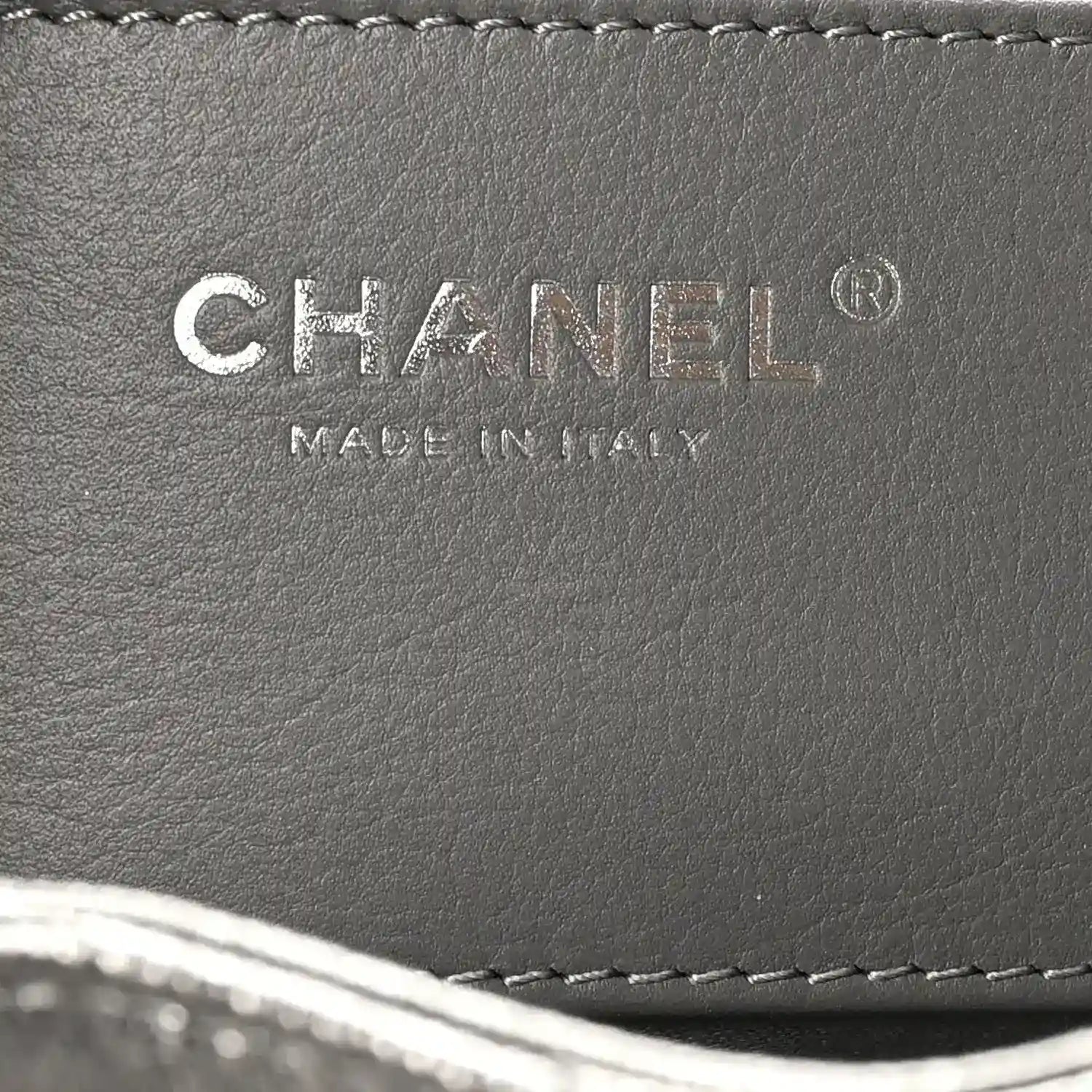 Chanel leather handbag label reading CHANEL and MADE IN ITALY