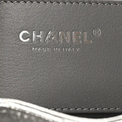 Chanel leather handbag label reading CHANEL and MADE IN ITALY