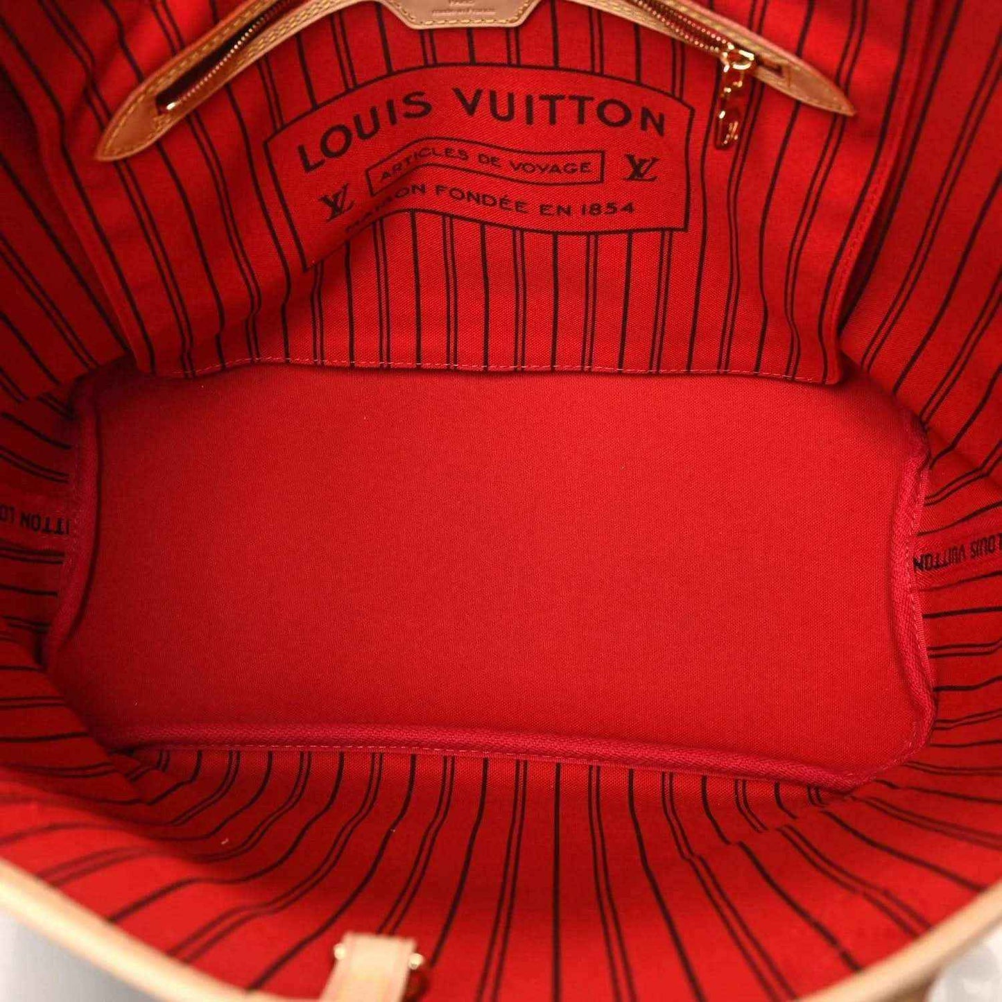 Louis Vuitton tote interior, red fabric lining with Louis Vuitton logo label