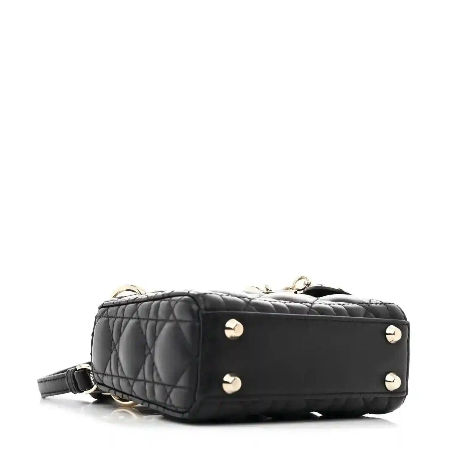 Black quilted micro handbag with gold-tone stud accents and short shoulder strap